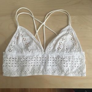 Out from under crochet-lace bralette
